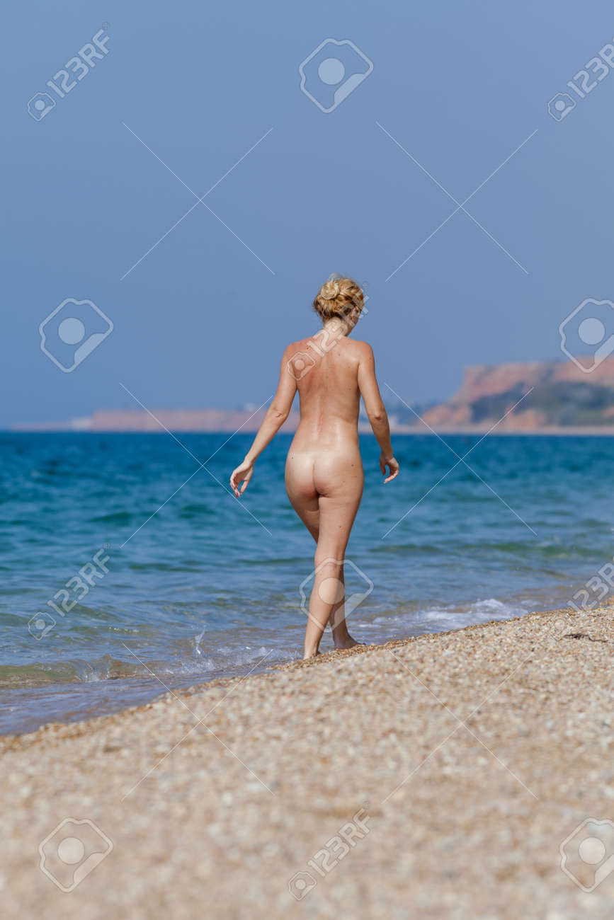 chinna british add nude women walking on beach photo